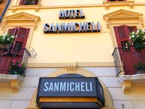a hotel sign on the side of a building at Hotel Sanmicheli in Verona
