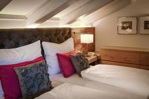 Postel nebo postele na pokoji v ubytování Hotel Happy Filzmoos