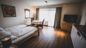 A bed or beds in a room at Appartementhaus Am Gschwandtkopf