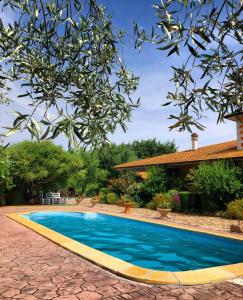 a swimming pool in the yard of a house at Casa vacanza centro Sardegna in Sorgono