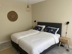 En eller flere senge i et værelse på Wildhof