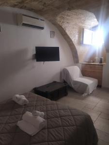 Postel nebo postele na pokoji v ubytování Abbazia Degli Svevi