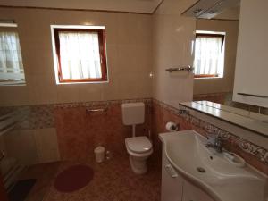 Koupelna v ubytování Apartmani Berber + 29 fotografií