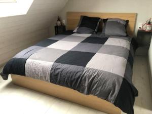 מיטה או מיטות בחדר ב-Gîtes du Tichweg