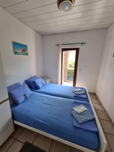 Postel nebo postele na pokoji v ubytování Apartman Tamy