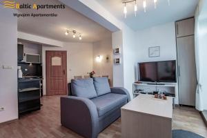 Telewizja i/lub zestaw kina domowego w obiekcie Baltic Apartments - Rezydencja Bursztyn