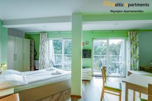 Łóżko lub łóżka w pokoju w obiekcie Baltic Apartments - Rezydencja Bursztyn