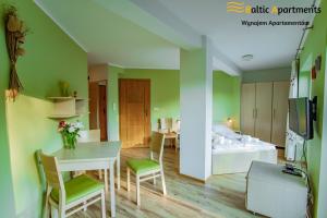 Telewizja i/lub zestaw kina domowego w obiekcie Baltic Apartments - Rezydencja Bursztyn