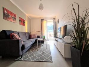Televízia a/alebo spoločenská miestnosť v ubytovaní Apartment 1A