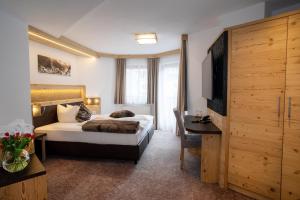 Postel nebo postele na pokoji v ubytování Hotel Victoria