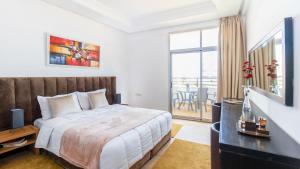 Postelja oz. postelje v sobi nastanitve Sables D'or Appart Hôtel