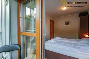 Łóżko lub łóżka w pokoju w obiekcie Baltic Apartments - Rezydencja Bursztyn