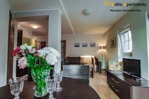Telewizja i/lub zestaw kina domowego w obiekcie Baltic Apartments - Rezydencja Bursztyn
