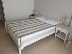 Postel nebo postele na pokoji v ubytování Alkyon Hotel