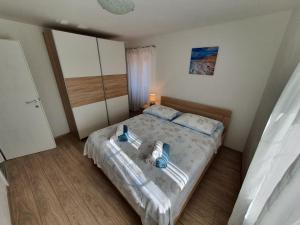 Posteľ alebo postele v izbe v ubytovaní Apartaments Ukić