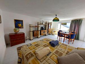 a bedroom with a bed and a table and chairs at Quinta do Chaparrinho in Sardoal