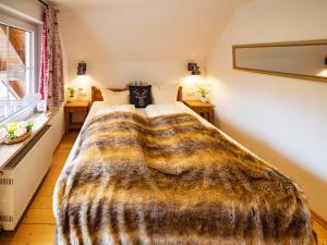 Ein Bett oder Betten in einem Zimmer der Unterkunft Holiday Apartements by Hotel Grüner Baum Feldberg