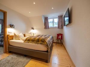 Ein Bett oder Betten in einem Zimmer der Unterkunft Holiday Apartements by Hotel Grüner Baum Feldberg