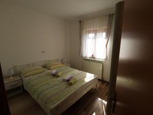 Postel nebo postele na pokoji v ubytování Apartmani Berber