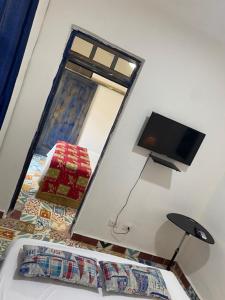 TV a/nebo společenská místnost v ubytování Chao Mamá Hostal