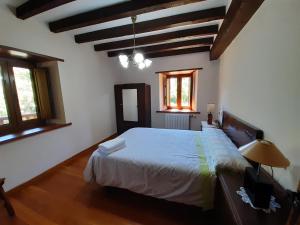 Łóżko lub łóżka w pokoju w obiekcie Casa Santa Leocadia