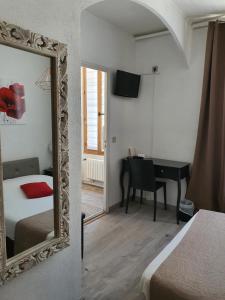 Postel nebo postele na pokoji v ubytování Ma Petite Auberge