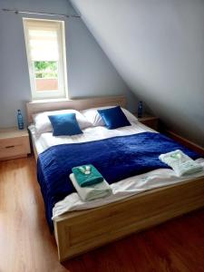 Ένα ή περισσότερα κρεβάτια σε δωμάτιο στο Dom całoroczny Wczasy jak Marzenie