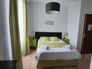 Postel nebo postele na pokoji v ubytování Ma Petite Auberge