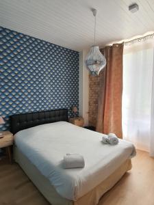 Postel nebo postele na pokoji v ubytování Ma Petite Auberge