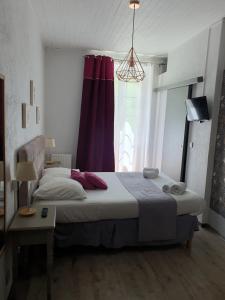 Postel nebo postele na pokoji v ubytování Ma Petite Auberge