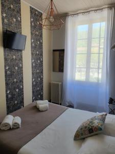 Postel nebo postele na pokoji v ubytování Ma Petite Auberge