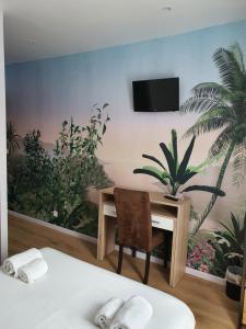 TV a/nebo společenská místnost v ubytování Ma Petite Auberge
