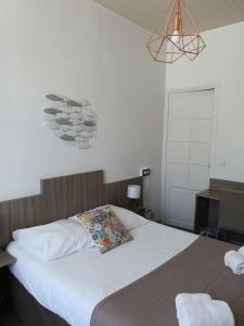 Postel nebo postele na pokoji v ubytování Ma Petite Auberge