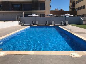 Bazén v ubytování Apartament SomRiu nebo v jeho okolí