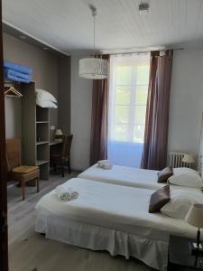 Postel nebo postele na pokoji v ubytování Ma Petite Auberge