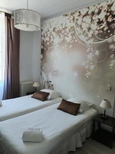 Postel nebo postele na pokoji v ubytování Ma Petite Auberge