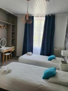Postel nebo postele na pokoji v ubytování Ma Petite Auberge