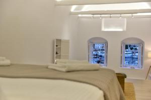 Posteľ alebo postele v izbe v ubytovaní Hydra Hospitality Port Apartment
