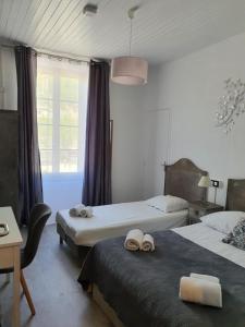 Postel nebo postele na pokoji v ubytování Ma Petite Auberge