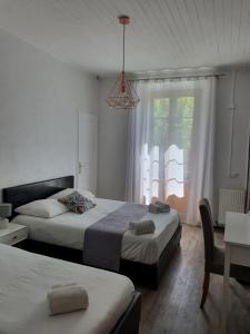 Postel nebo postele na pokoji v ubytování Ma Petite Auberge