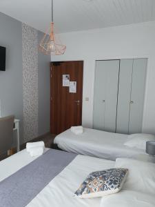 Postel nebo postele na pokoji v ubytování Ma Petite Auberge