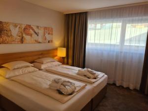 Voodi või voodid majutusasutuse Hotel Zirbenhof toas
