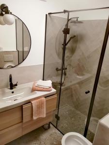 a bathroom with a shower and a sink at Rainbow apartment, Koper in Koper