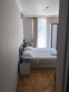 Postel nebo postele na pokoji v ubytování Hotel Dolphin Batumi