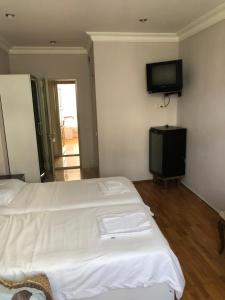 Postel nebo postele na pokoji v ubytování Hotel Dolphin Batumi