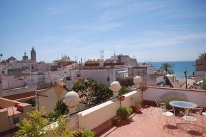 a balcony with a view of a city at Sitges Apartment in Sitges