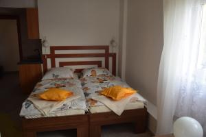 Posteľ alebo postele v izbe v ubytovaní Apartament Czos