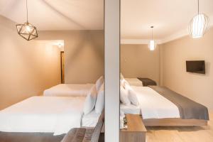 Voodi või voodid majutusasutuse Hotel Stancia Kazbegi - City Center toas