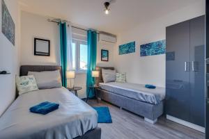 Postel nebo postele na pokoji v ubytování Oliva Vallis Apartments