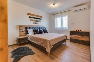 Postel nebo postele na pokoji v ubytování Oliva Vallis Apartments